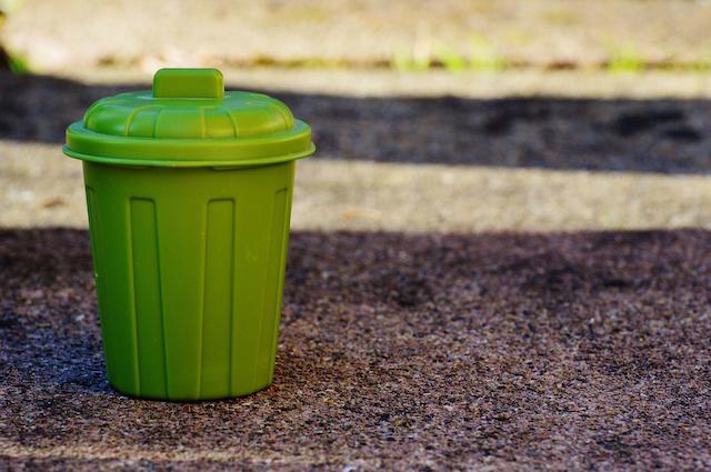 Small green dustbin.