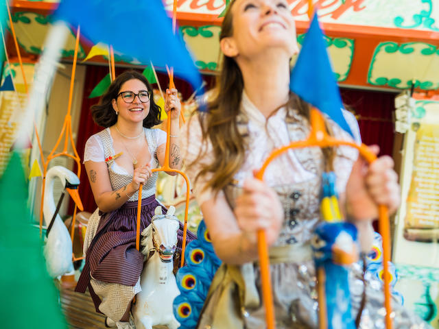 Laughing women hanging carousel