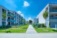 A residential complex with green spaces in the middle.