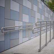 A barrier-free staircase with railings and wheelchair ramp