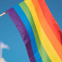 Rainbow flag blowing in the wind.