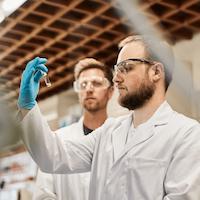 Employees analyzing a water sample.