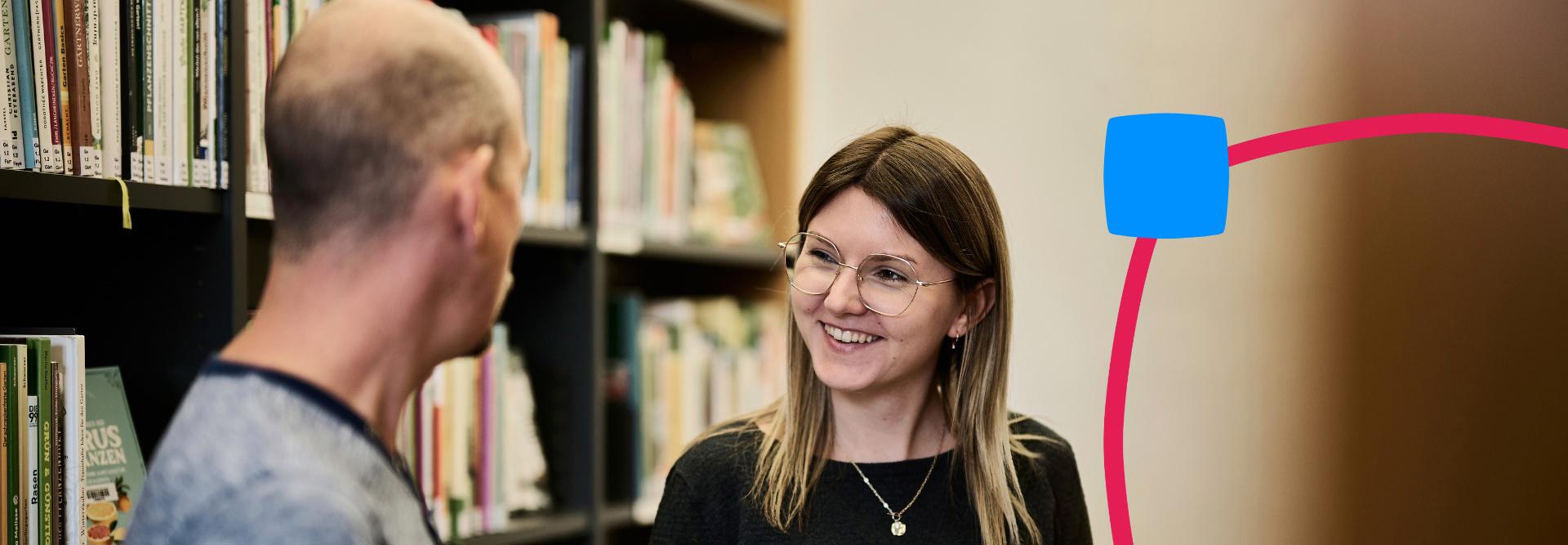 City library employee giving advice on books.