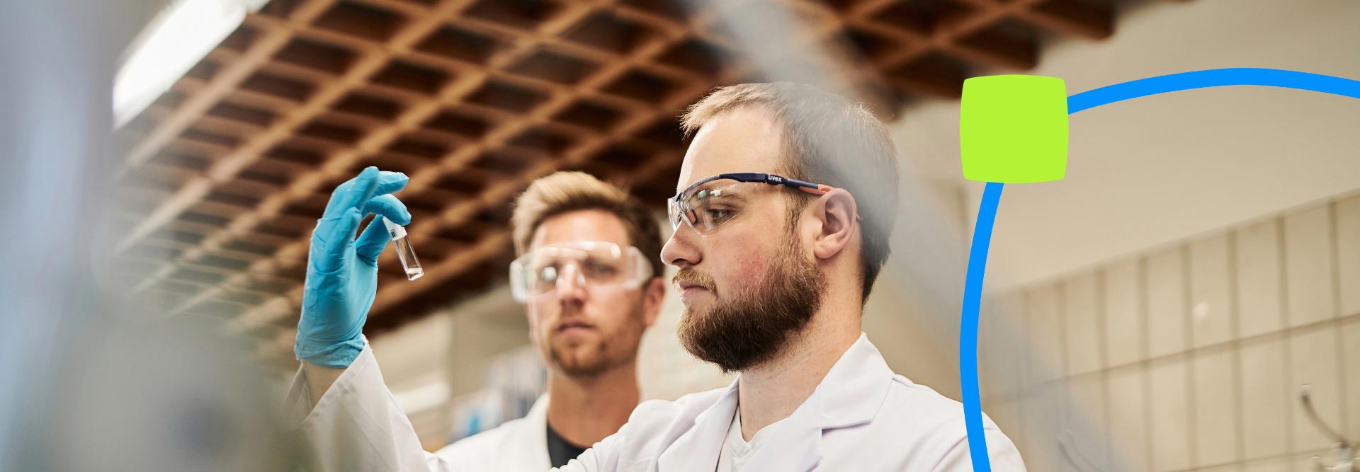 Employees analyzing a water sample.